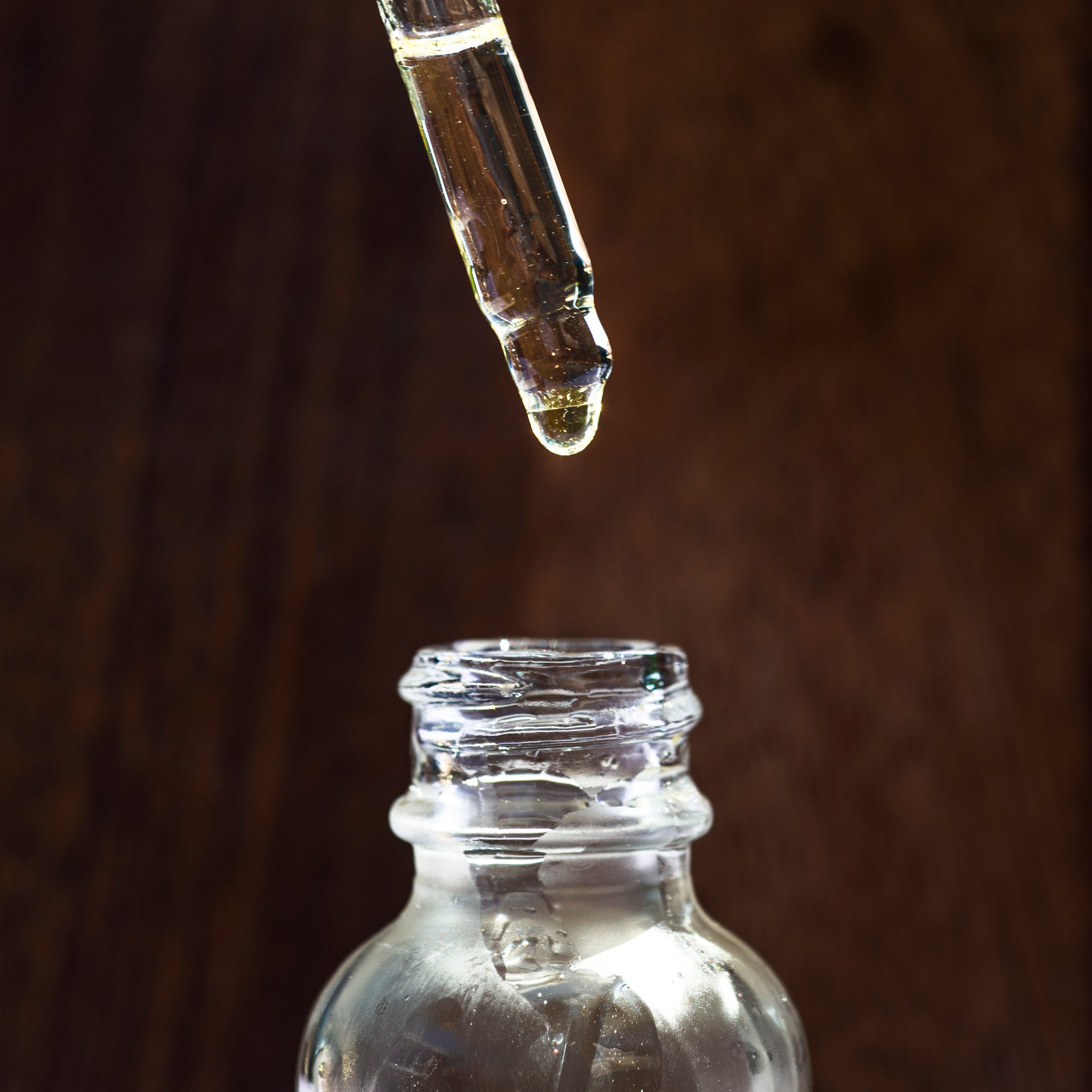 glass-jar-of-face-oil-and-a-dropper-above-it.jpg