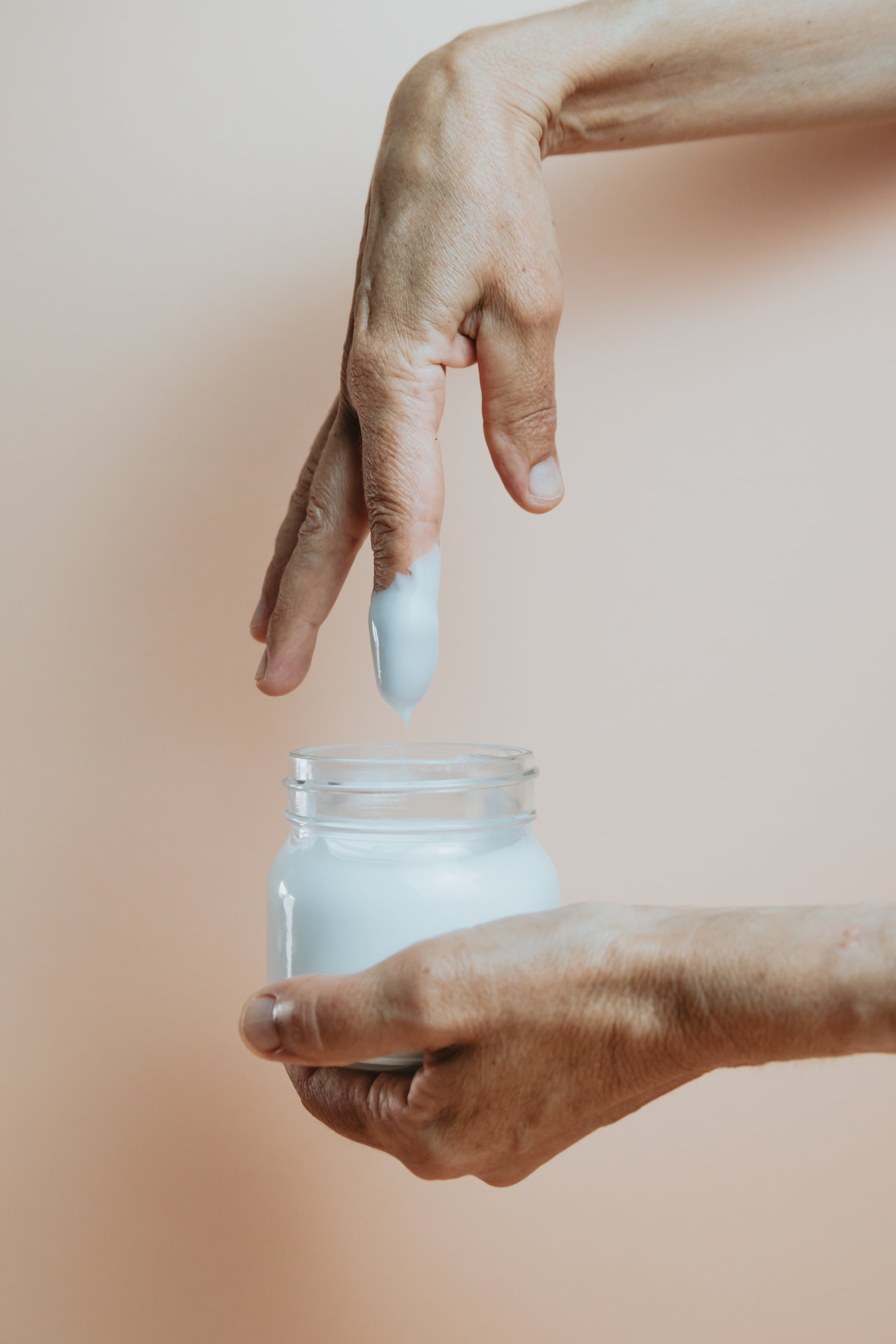 hand-and-a-glass-jar-of-hand-cream.jpg