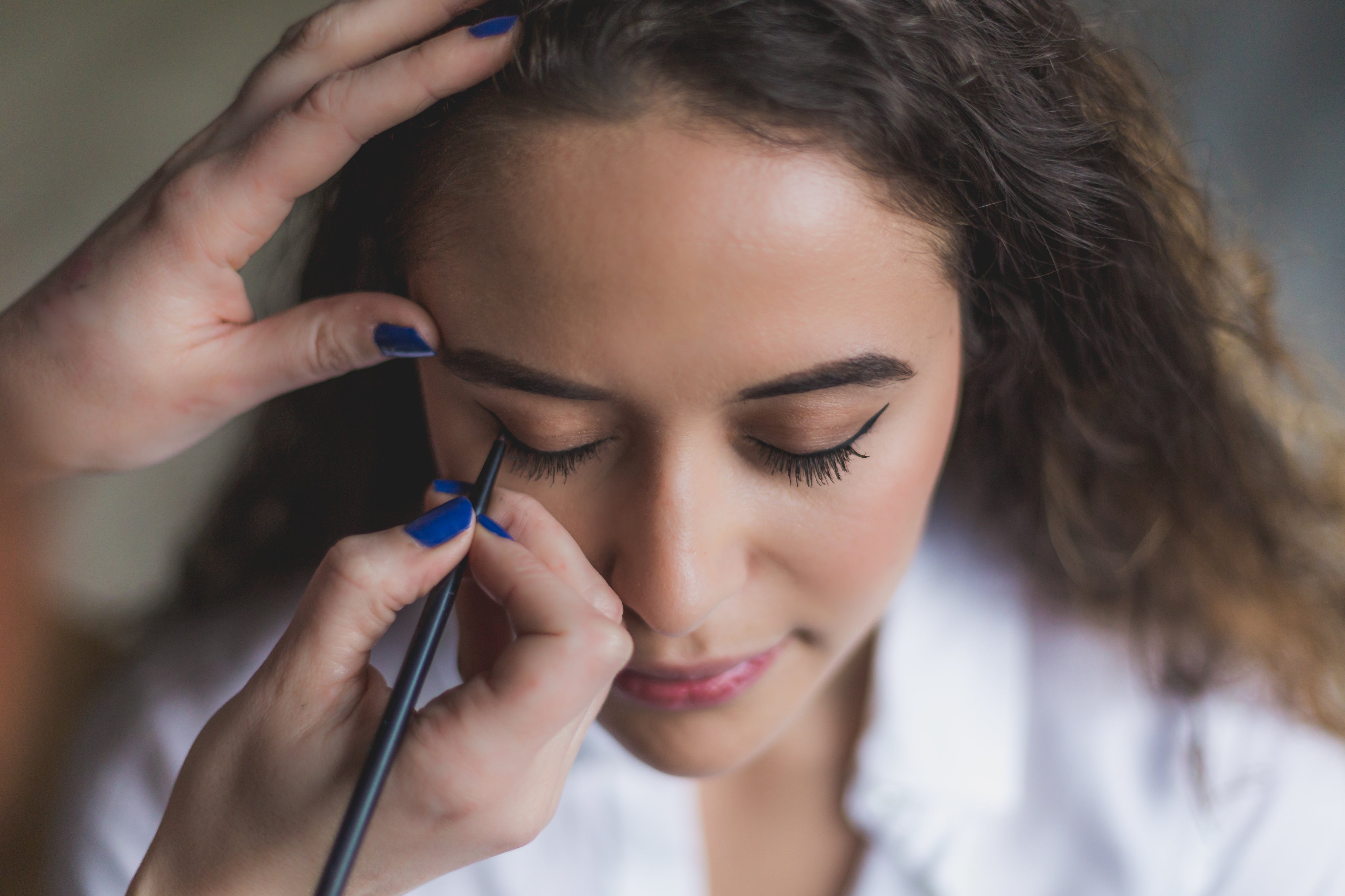 woman-gets-eyeliner-applied.jpg